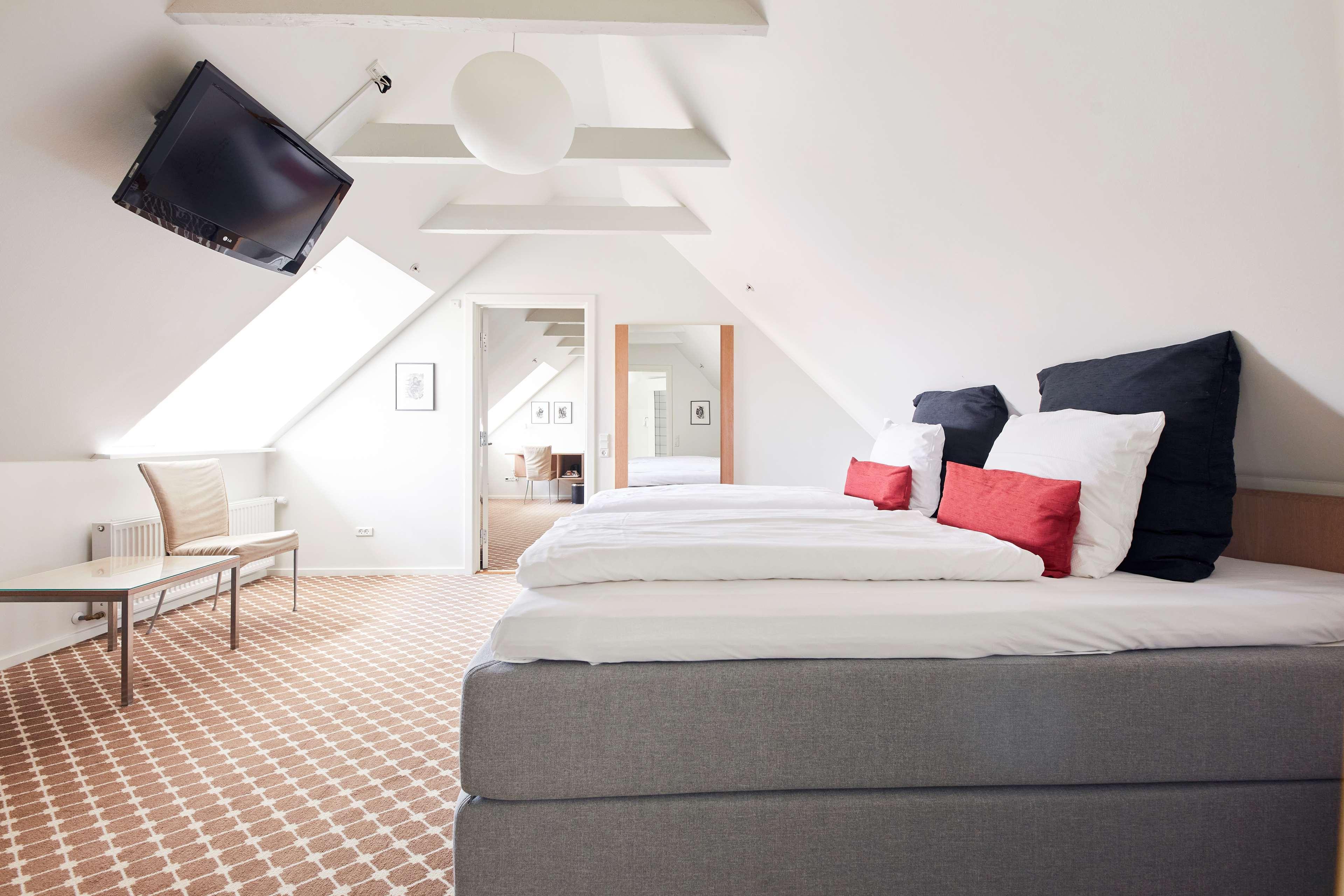 Suite mit Kingsize-Bett und Whirlpool